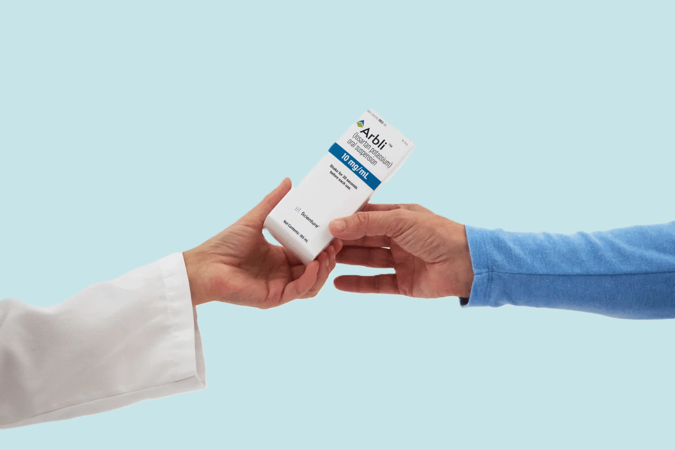 Arbli-Box-Pharm-Patient-blue Pharmacist handing Arbli box to a patient