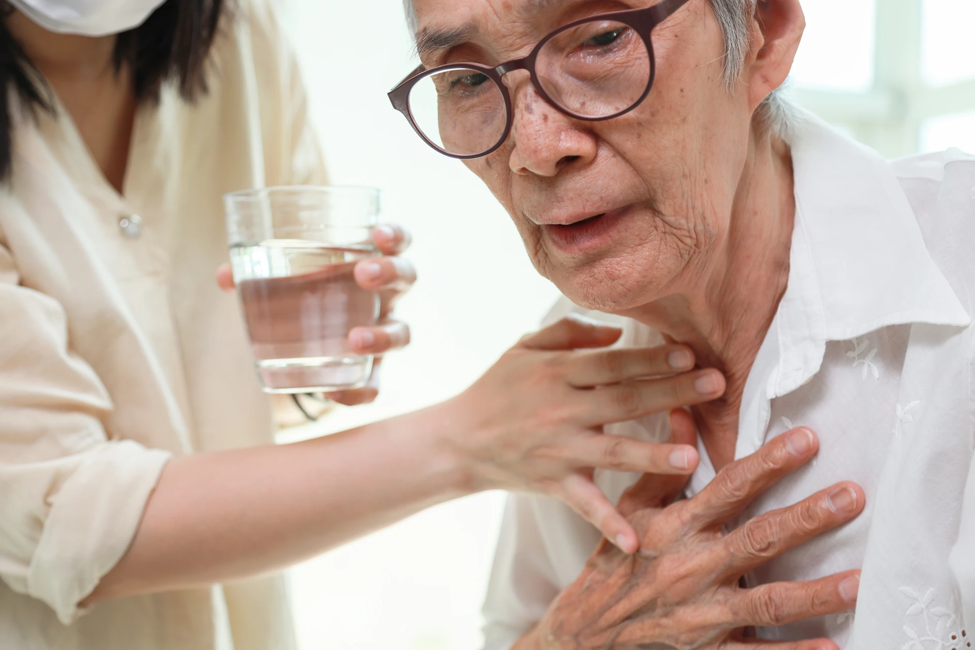 Elderly patient experiencing difficulty swallowing Elderly patient experiencing difficulty swallowing